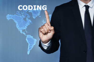 Image of Businessman pointing at word CODING and illustration of digital map on background, closeup 