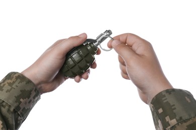 Photo of Soldier pulling safety pin out of hand grenade on white background, closeup
