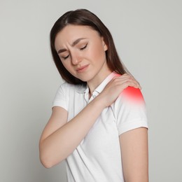 Image of Woman suffering from rheumatism on light background