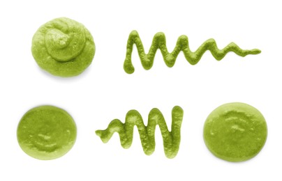 Image of Set with spicy wasabi paste on white background, top view