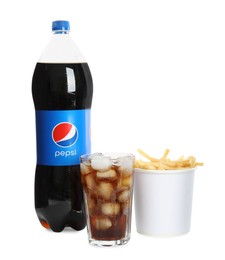 MYKOLAIV, UKRAINE - FEBRUARY 15, 2021: Glass and bottle of Pepsi with snack on white background