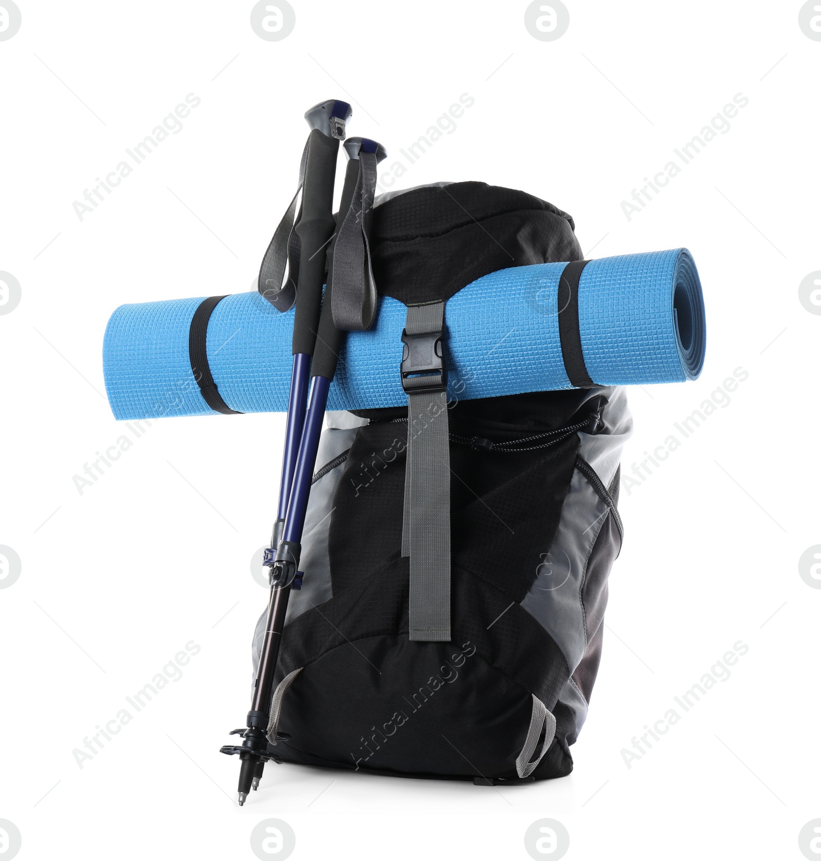 Photo of Pair of trekking poles and camping equipment for tourism on white background