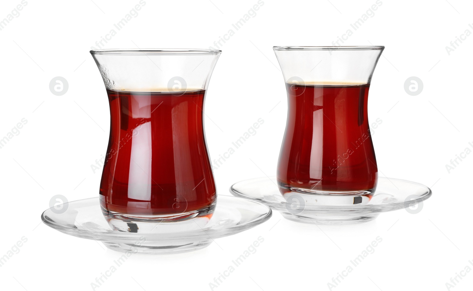 Photo of Glasses with traditional Turkish tea isolated on white