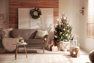 Image of Stylish living room with Christmas decorations. Festive interior design