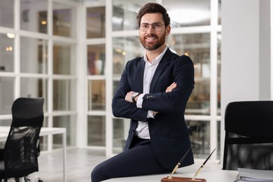 Photo of Portrait of smiling man with crossed arms in office, space for text. Lawyer, businessman, accountant or manager