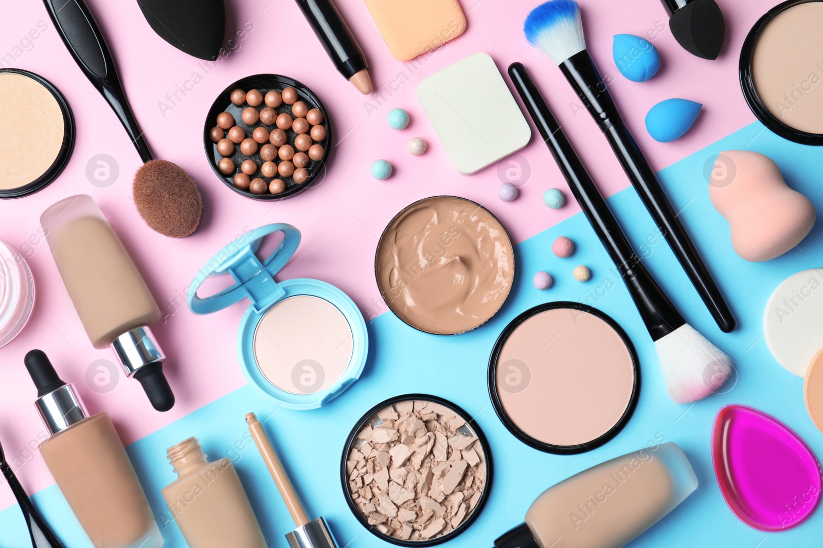 Photo of Flat lay composition with skin foundation, powder and beauty accessories on color background