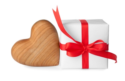 Photo of Beautiful gift box and toy heart on white background. Valentine's day celebration