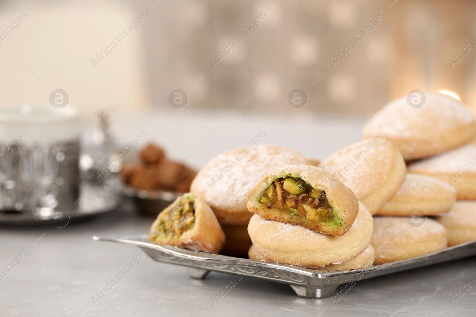 Photo of Traditional Islamic cookies on table, space for text. Eid Mubarak