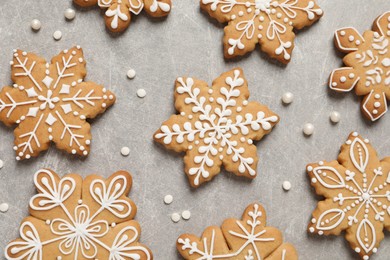 Photo of Tasty Christmas cookies on light grey table, flat lay