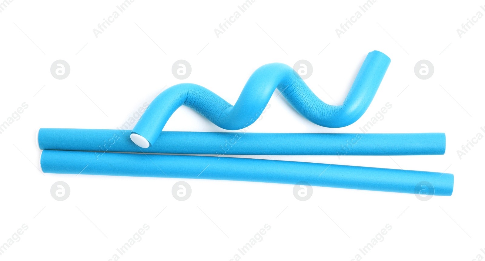 Photo of Curling rods isolated on white, top view. Hair styling tool