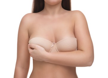 Mammology. Woman in bra doing breast self-examination on white background, closeup