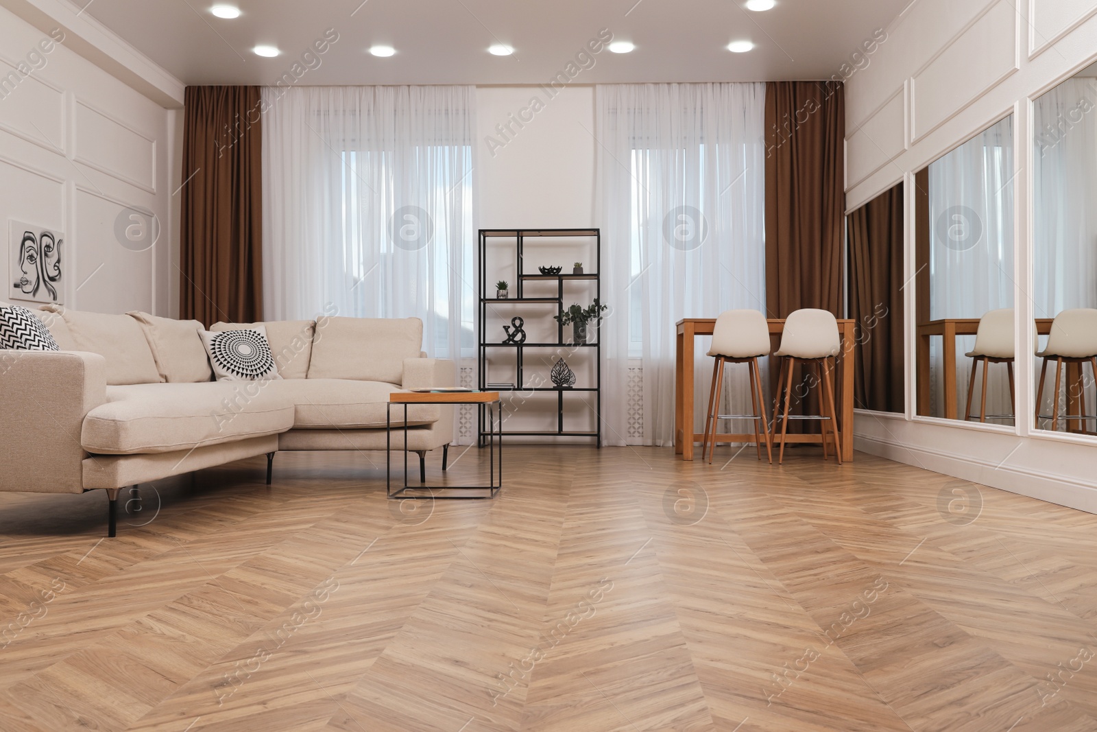 Photo of Modern living room with parquet flooring and stylish furniture