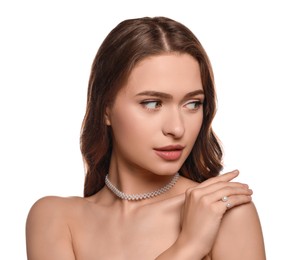 Photo of Young woman wearing elegant pearl jewelry on white background