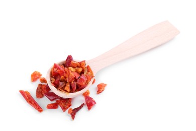 Photo of Aromatic spice. Red chili pepper flakes in spoon isolated on white