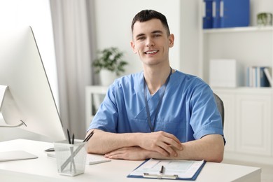 Photo of Portrait of smiling medical assistant in office