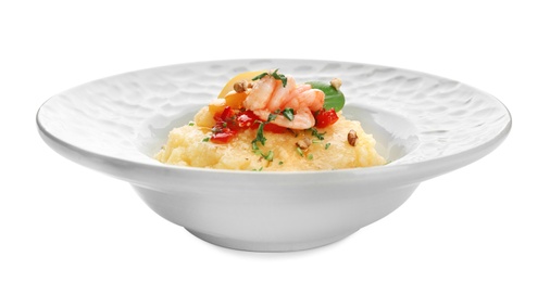 Plate with tasty shrimps and grits on white background