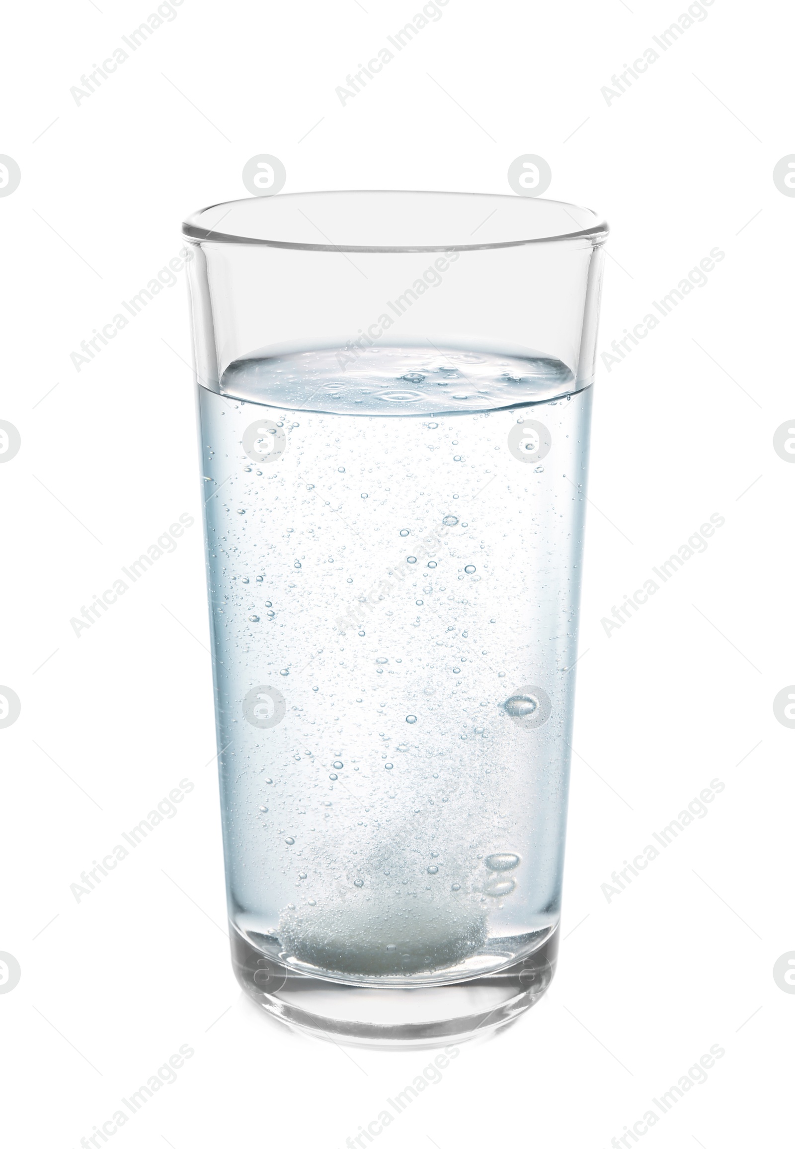 Photo of Effervescent pill dissolving in glass of water isolated on white