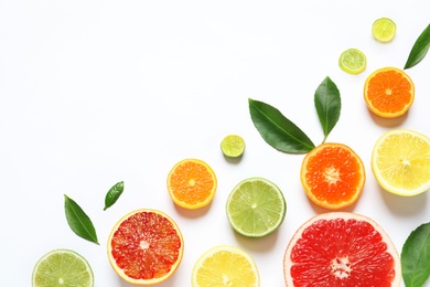 Photo of Flat lay composition with different citrus fruits on white background