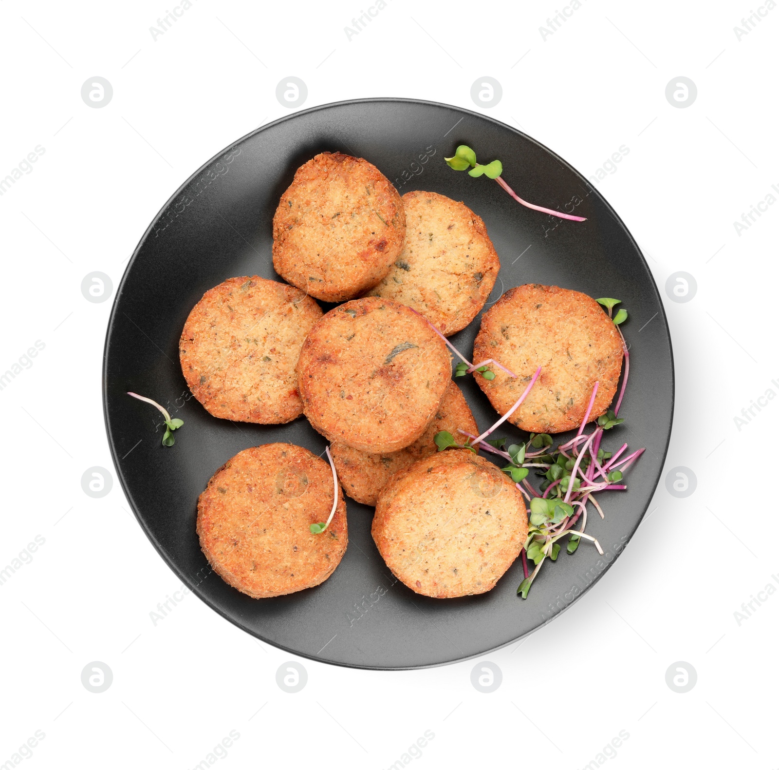 Photo of Plate of delicious vegan cutlets and microgreens isolated on white, top view