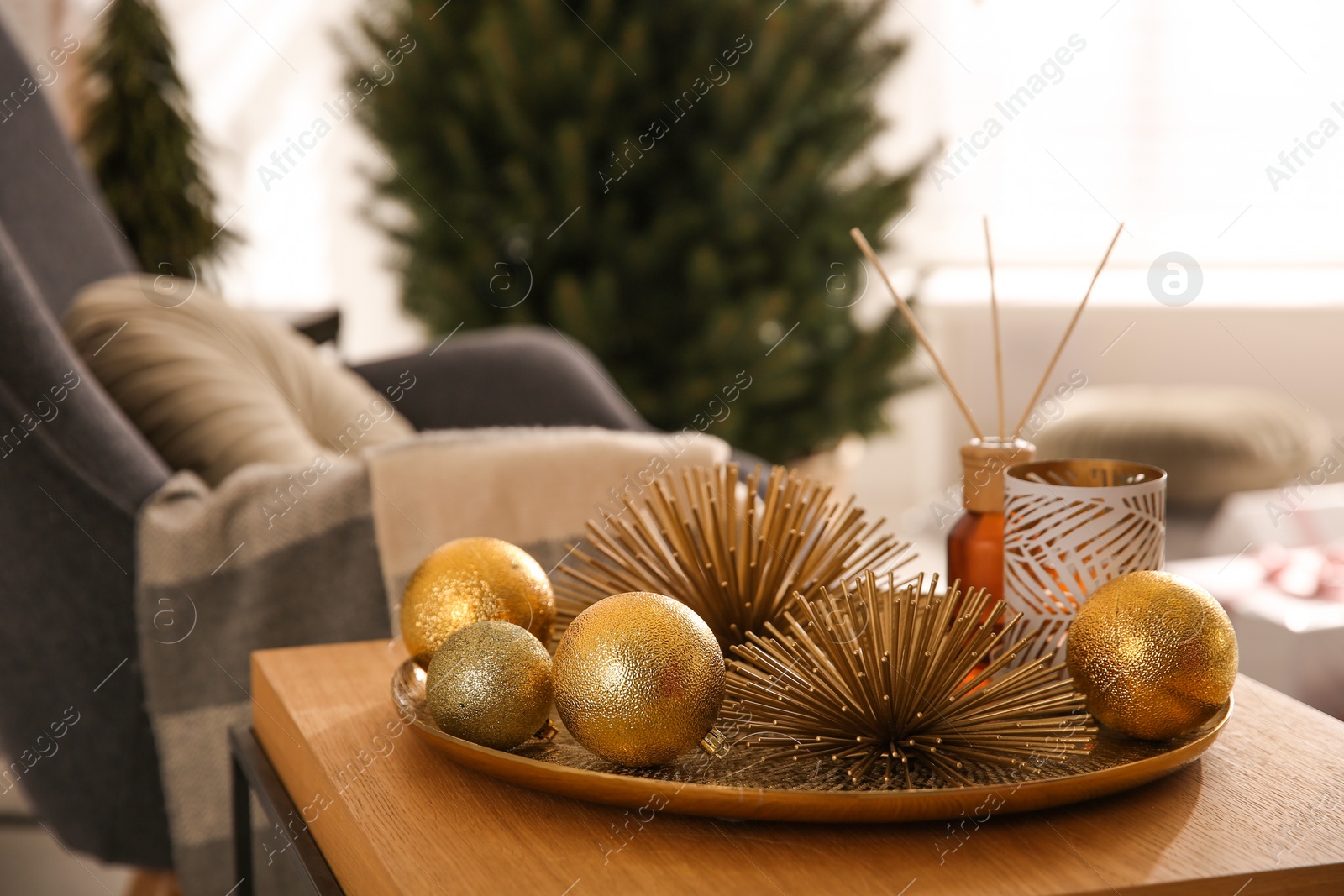 Photo of Elegant Christmas decor on table indoors. Interior design