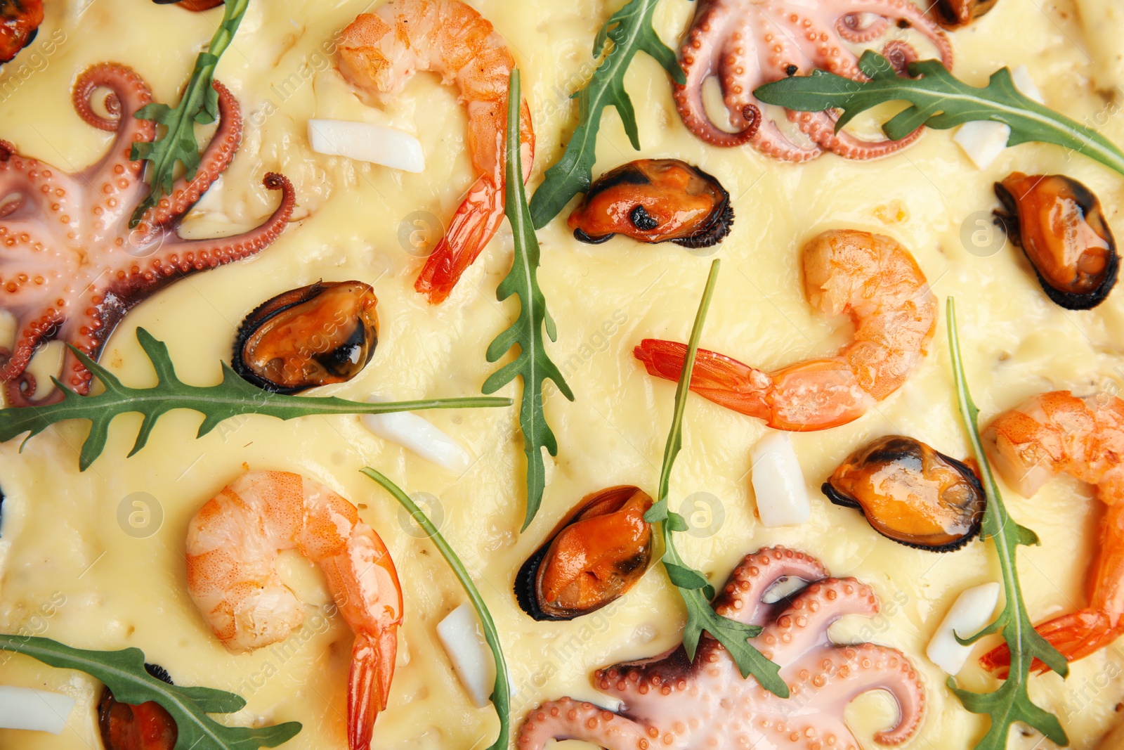 Photo of Delicious seafood pizza as background, top view