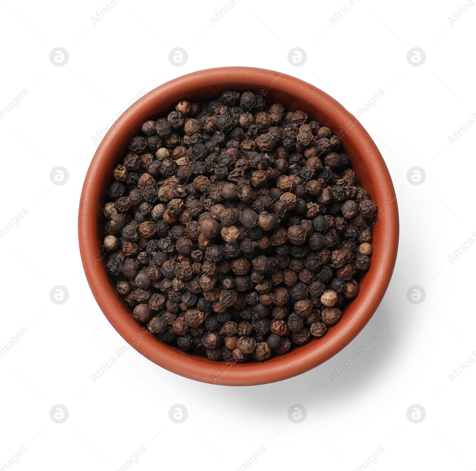 Photo of Aromatic spice. Many black peppercorns in bowl isolated on white, top view