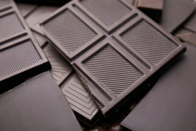 Photo of Many tasty chocolate bars as background, closeup