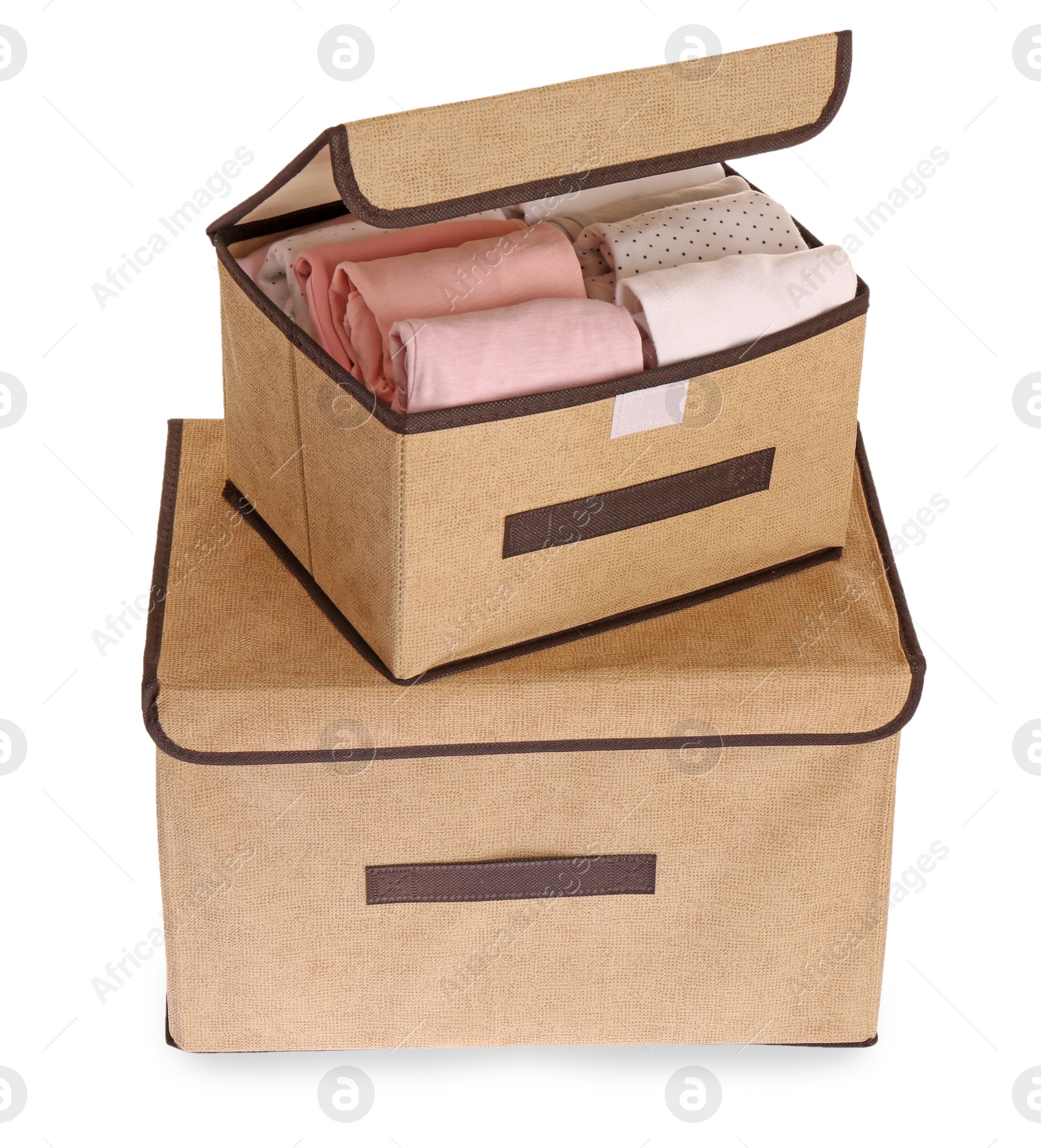 Photo of Textile storage cases with folded clothes on white background