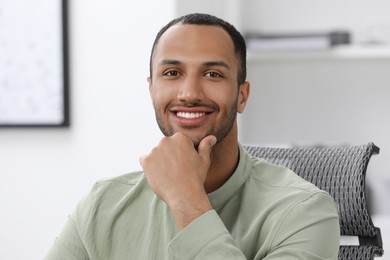 Portrait of handsome young man at home