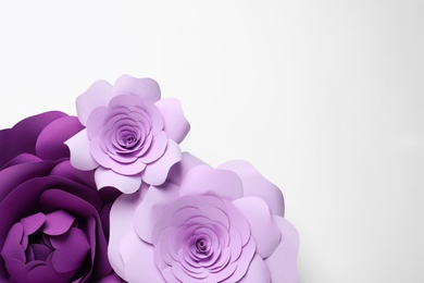 Different beautiful flowers of paper on white background, top view