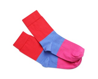Photo of Pair of colorful striped socks on white background, top view