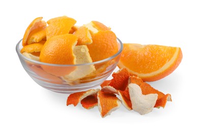 Dry orange peels and piece of fresh fruit isolated on white