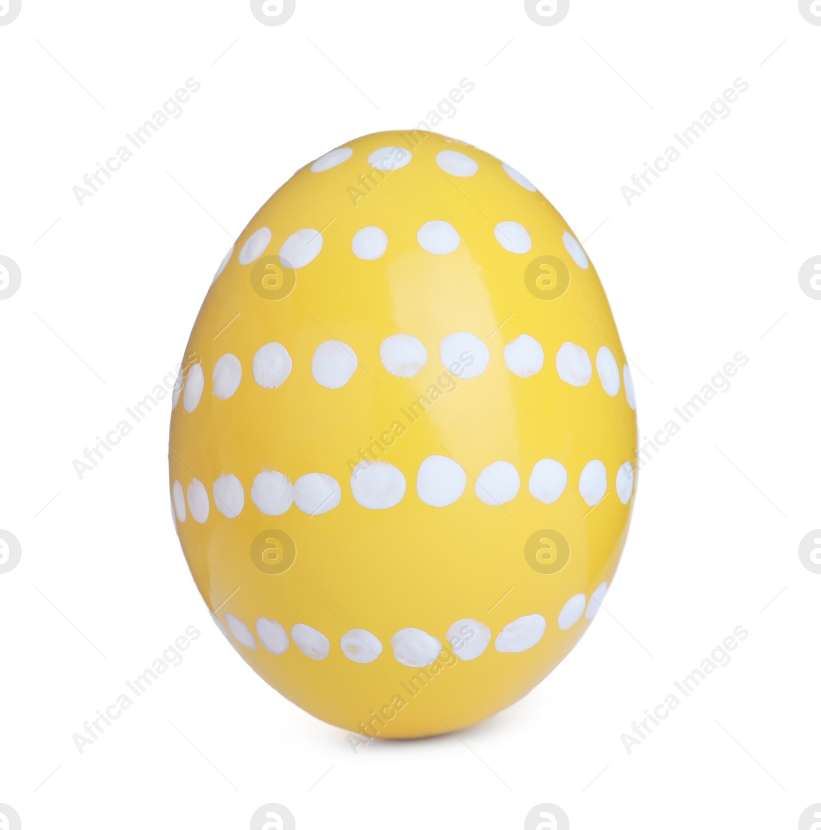 Photo of Painted yellow egg with pattern isolated on white. Happy Easter