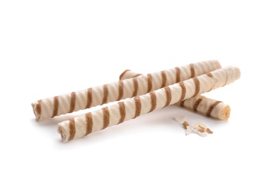 Photo of Tasty wafer roll sticks on white background. Crispy food