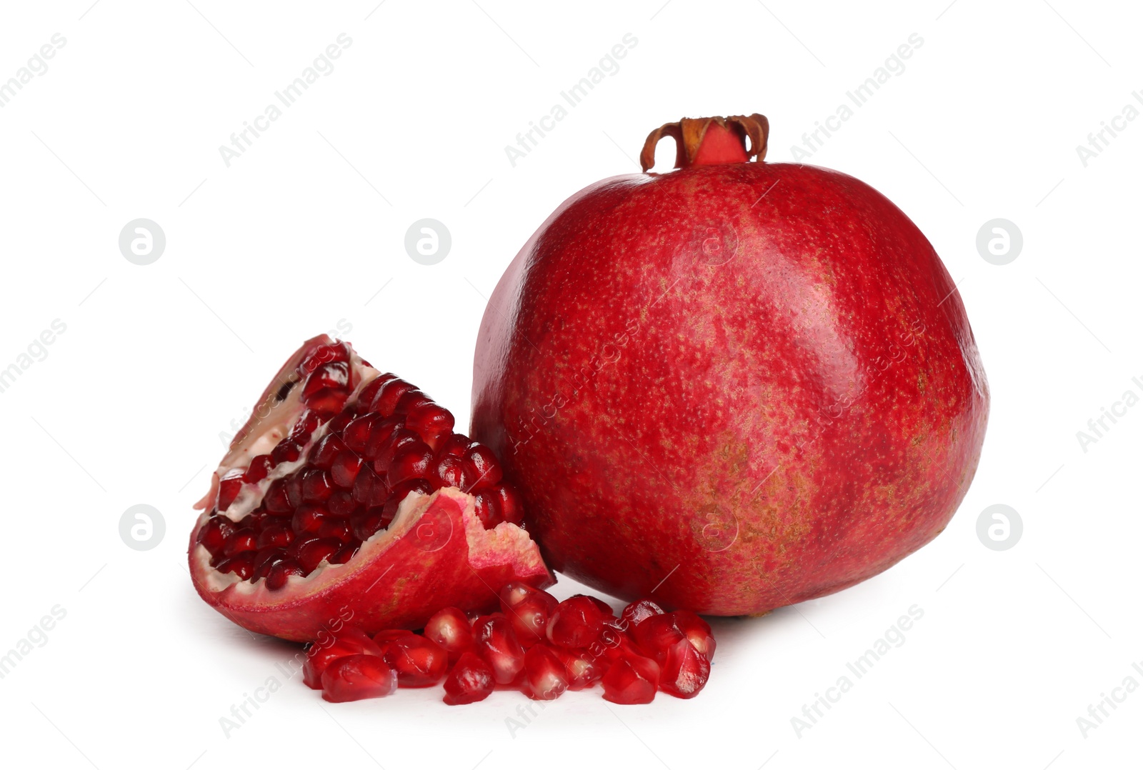 Photo of Ripe pomegranates on white background. Delicious fruits