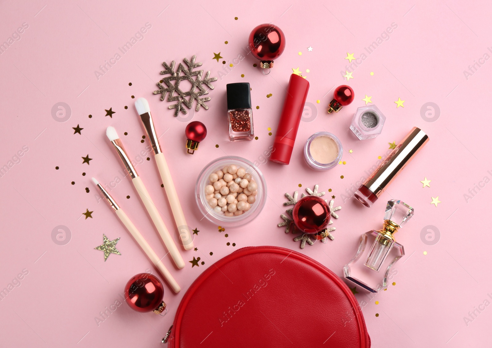 Photo of Flat lay composition with decorative cosmetic products on pink background. Winter care