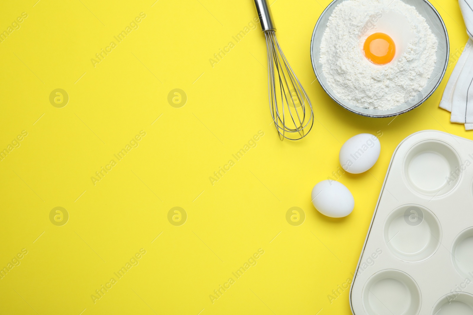 Photo of Cooking utensils and ingredients on yellow background, flat lay. Space for text