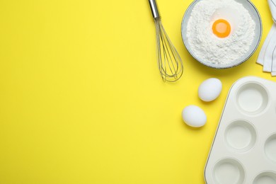 Cooking utensils and ingredients on yellow background, flat lay. Space for text