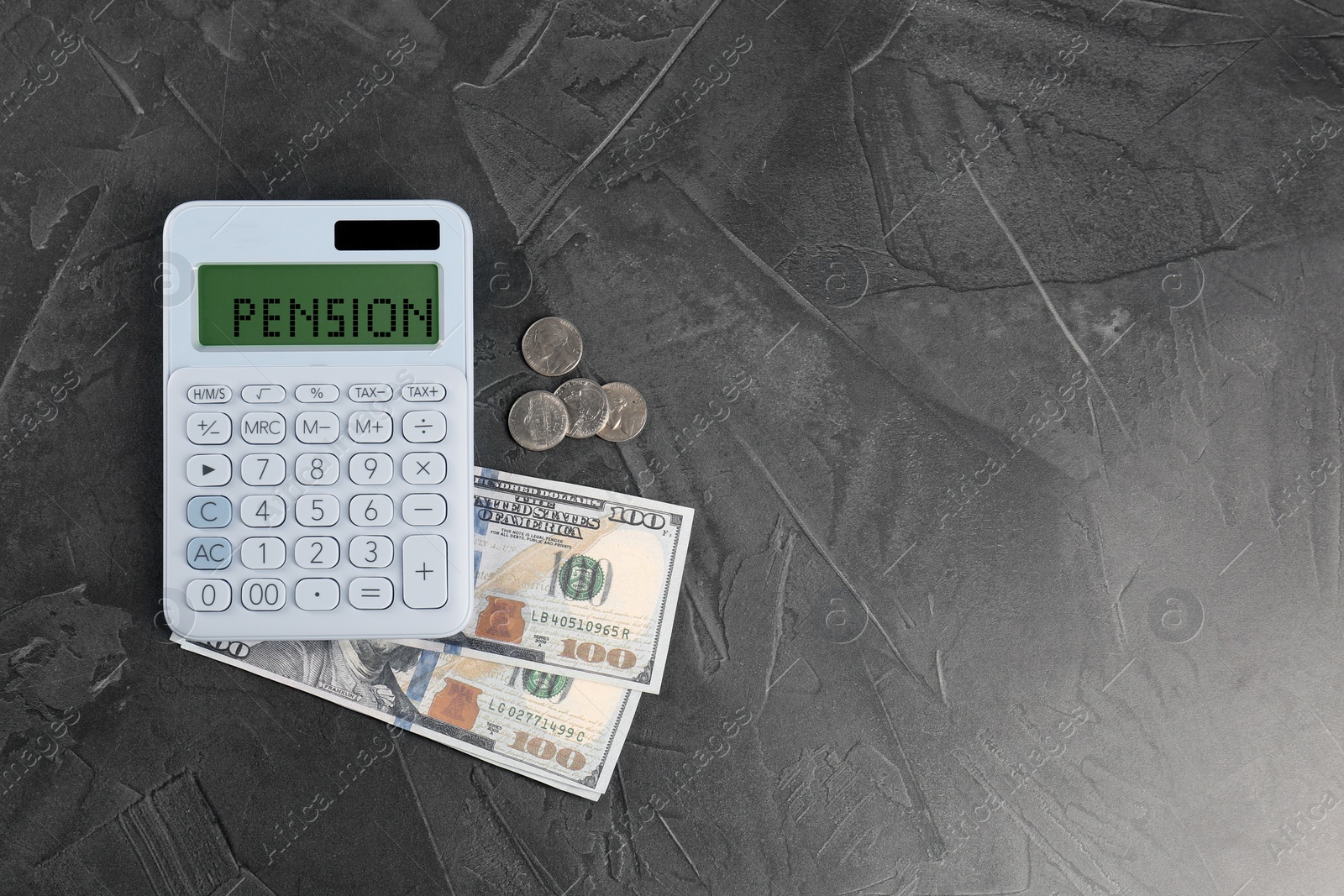 Image of Calculator with word Pension and money on grey table, top view. Space for text