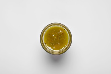 Photo of Tasty canned kiwi jam on white background, top view