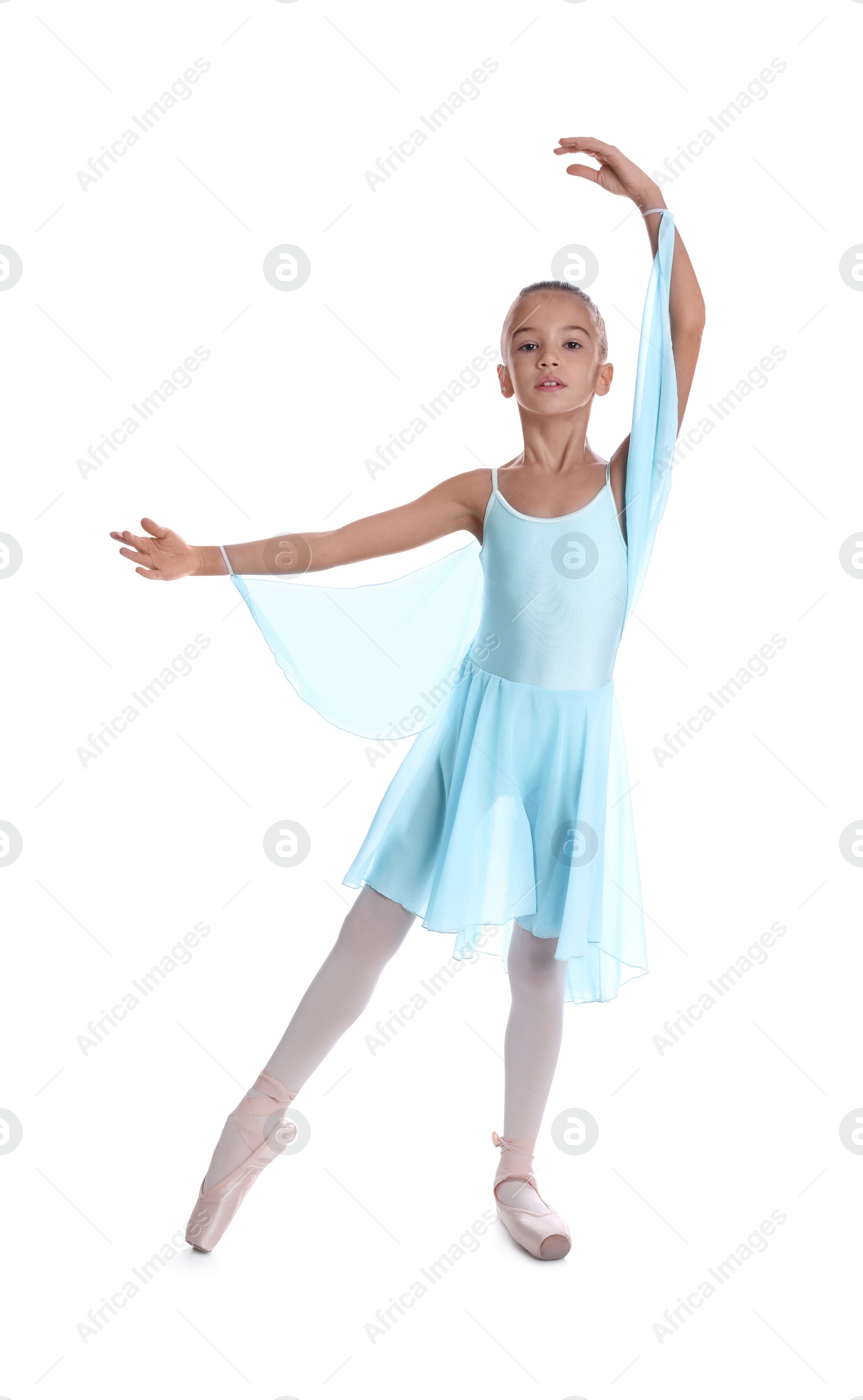 Photo of Beautifully dressed little ballerina dancing on white background