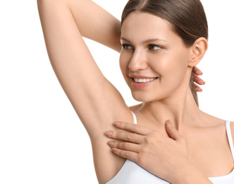 Young beautiful woman showing armpit with smooth clean skin on white background