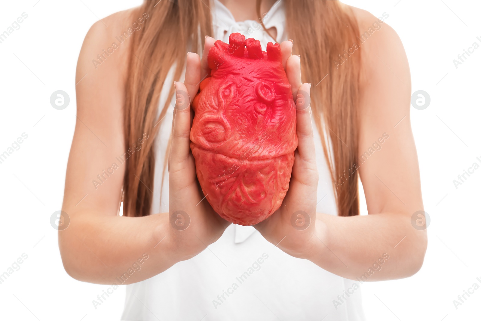 Photo of Woman holding model of heart on white background. Heart attack concept