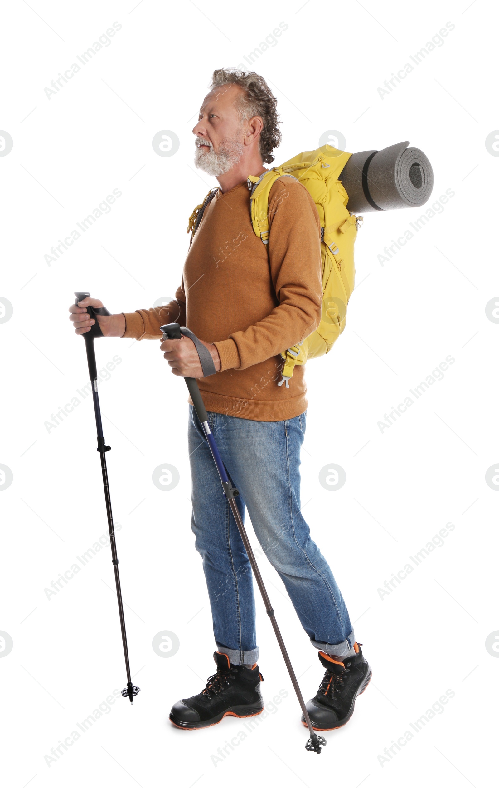 Photo of Male hiker with backpack and trekking poles on white background