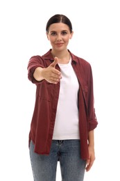 Photo of Beautiful young woman welcoming and offering handshake on white background