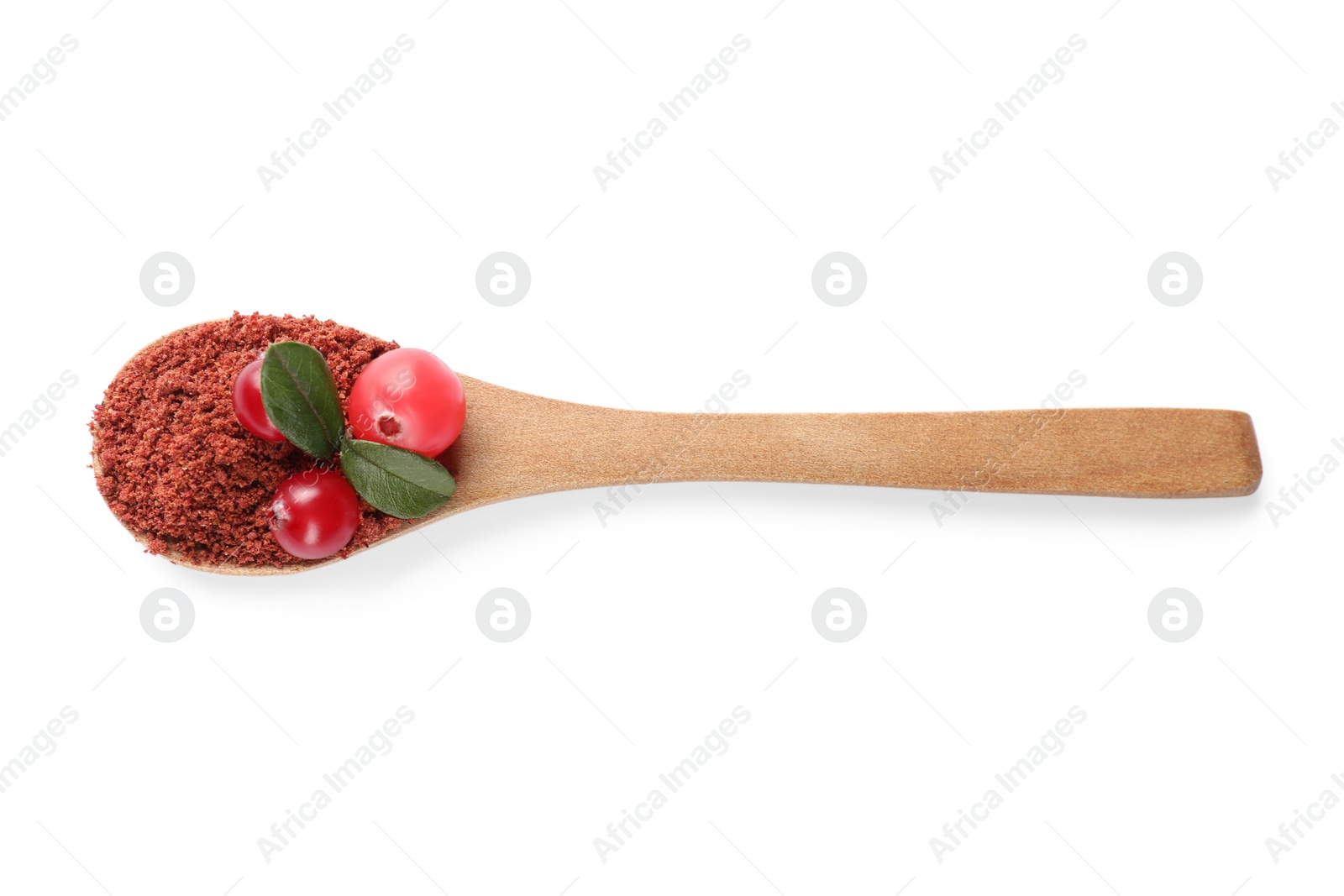 Photo of Wooden spoon with dried cranberry powder, fresh berries and green leaves isolated on white, top view