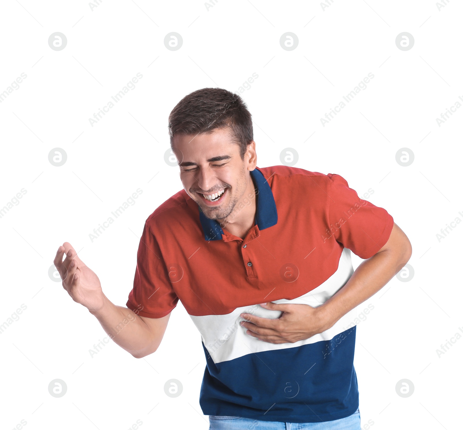 Photo of Portrait of handsome young man laughing on white background