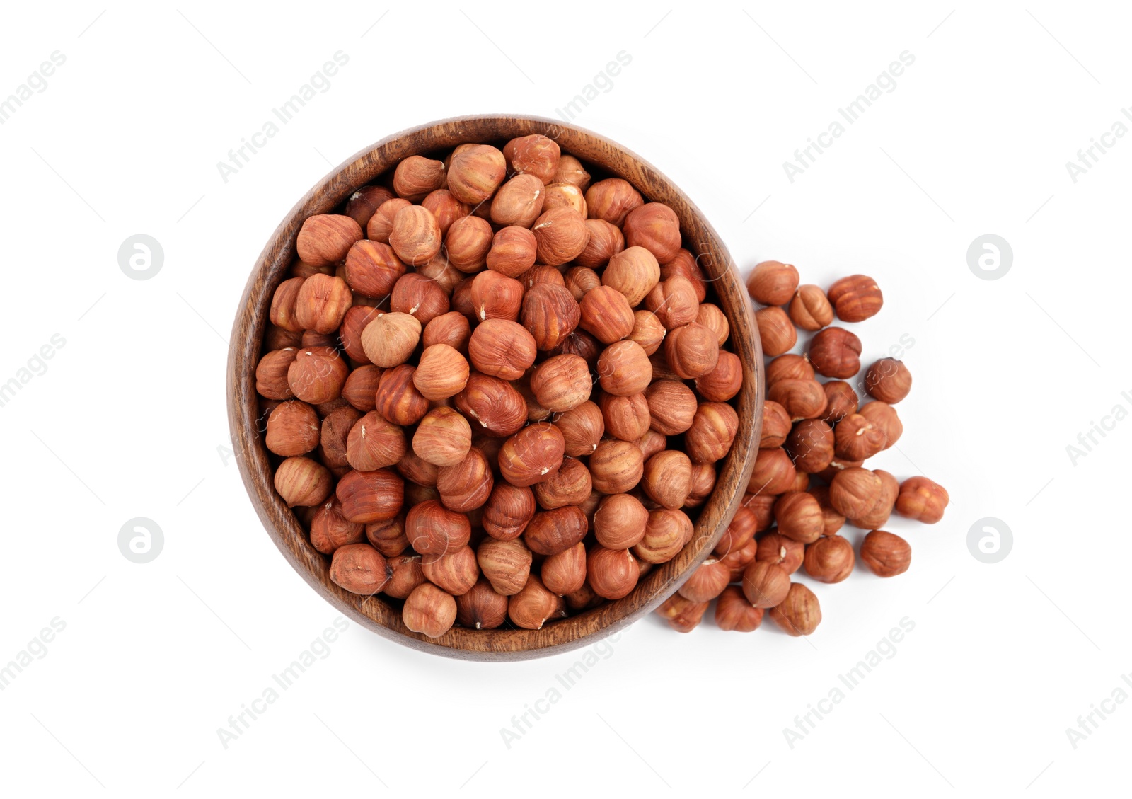 Photo of Bowl with tasty organic hazelnuts on white background, top view