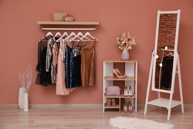 Photo of Collection of trendy women's garments in clothing rental salon