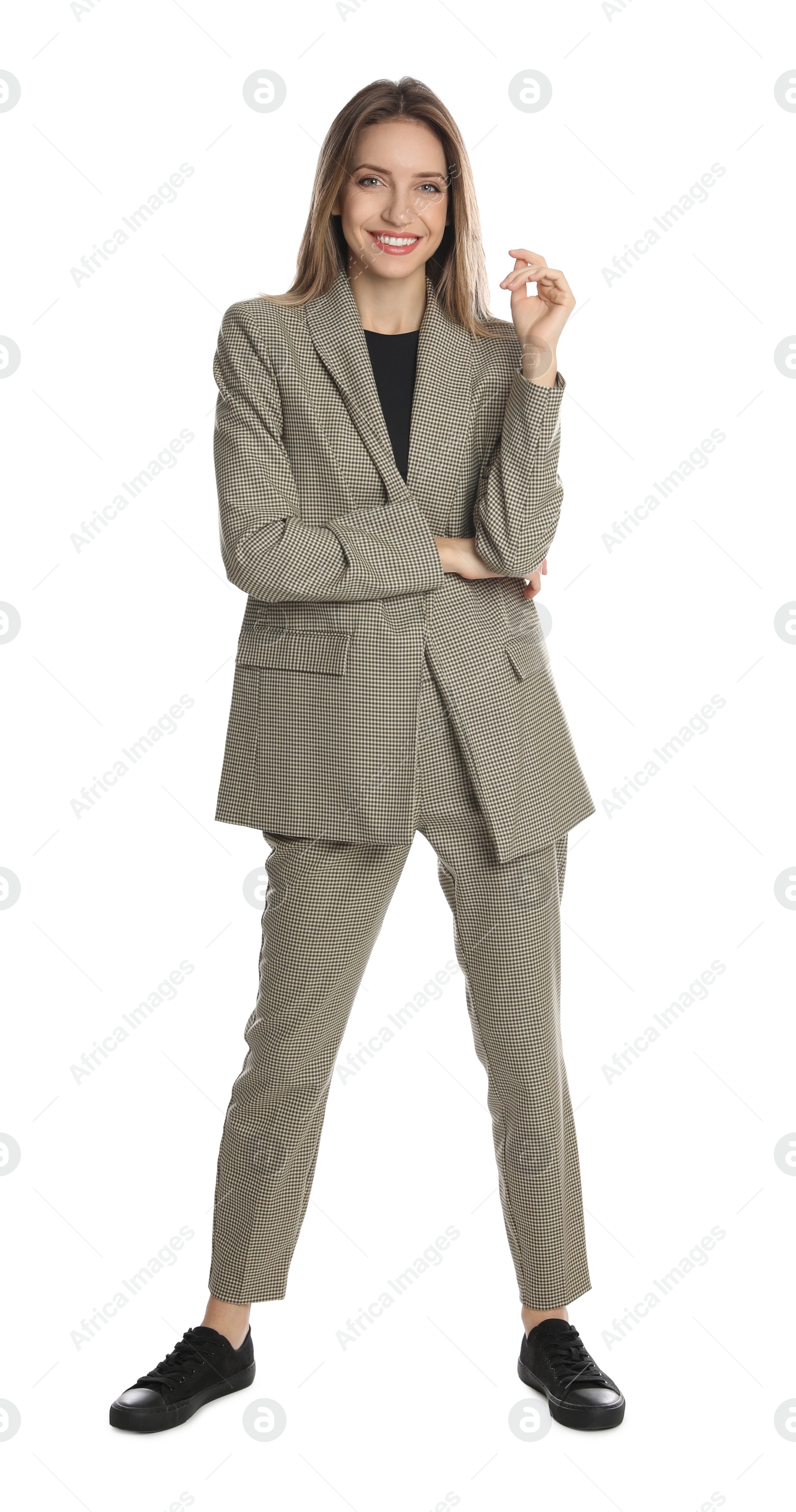 Photo of Full length portrait of beautiful young woman in fashionable suit on white background. Business attire